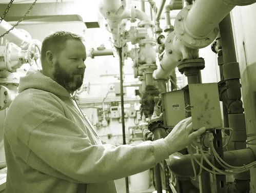 A man working in a city water treatment plant