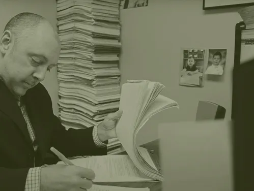 A man signing documents