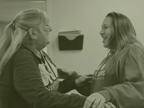 Two women smiling