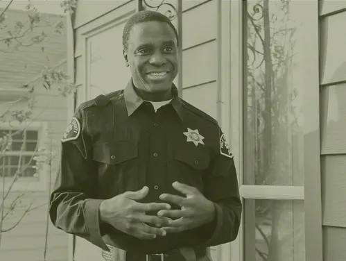 A Public Safety Officer standing and smiling