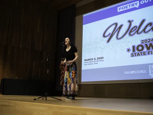 Student competing in the 2024 Iowa State Finals of Poetry Out Loud
