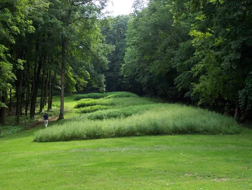 Effigy Mounds - Marching Bear group with visitor (NPS photo)