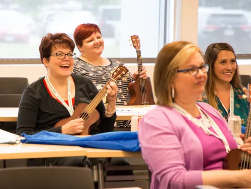 Ukelele players in a classroom