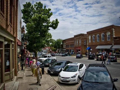 Busy main street scene with people walking