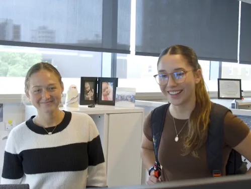 Interns looking at a computer together
