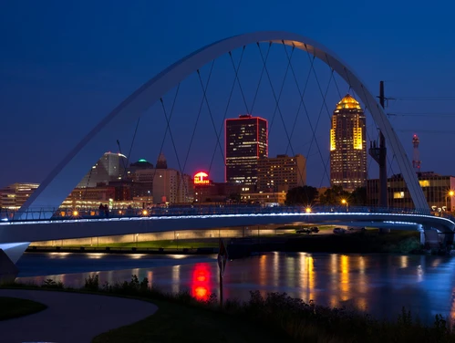 Downtown skyline at night with a bridge