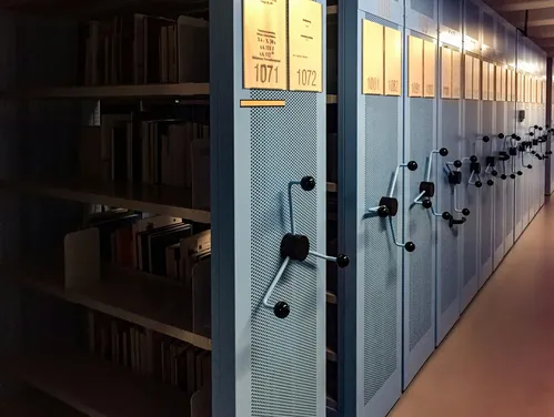 Archives - books in shelves in room