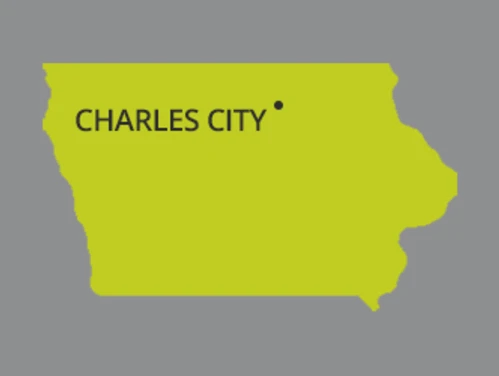 Green map of Iowa with Charles City pinpointed