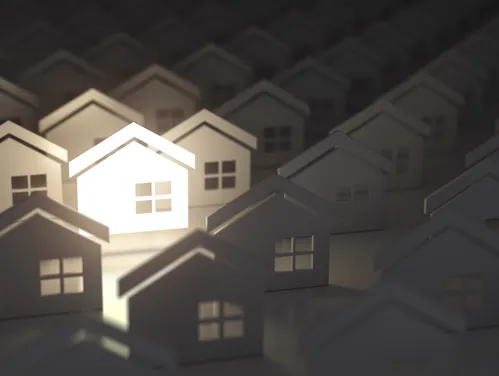 Illustration of homes with one lit up