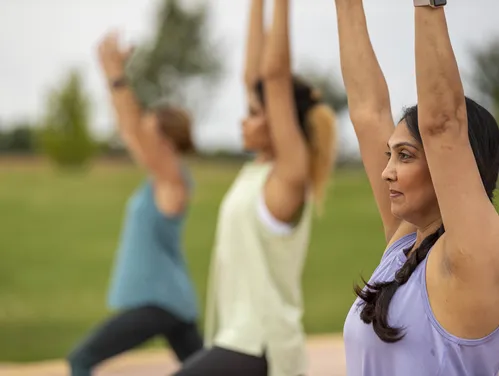 Close up of people doing yoga