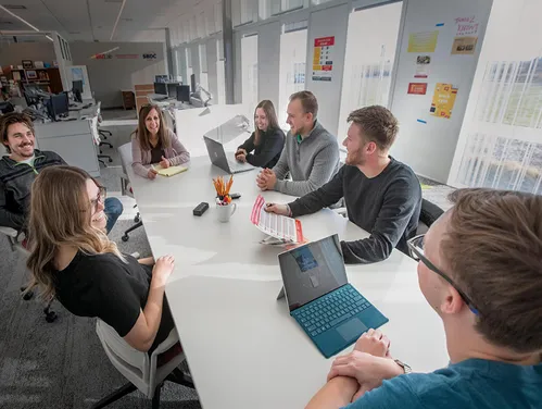 group of people meeting around a table