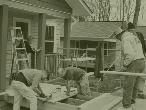 group of Habitat for Humanity volunteers working on house construction