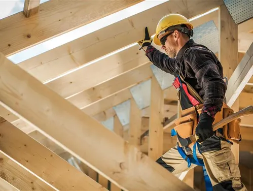 Construction Worker with toolbelt working