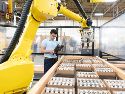 person working un a manufacturing line