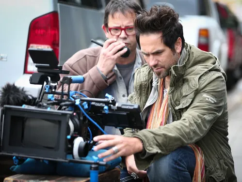 Two men behind a movie camera