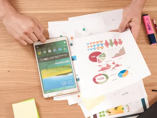 Person reviewing charts and graphs