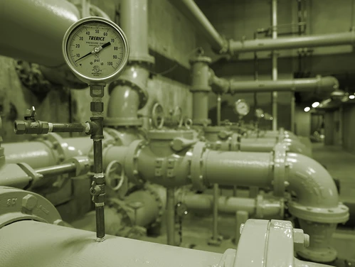 Pipes and gauge inside water treatment facility