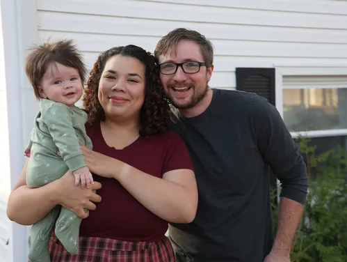 The Gorsett family in front of their home 