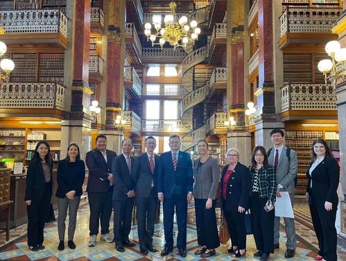 group of people in the iowa capitol library