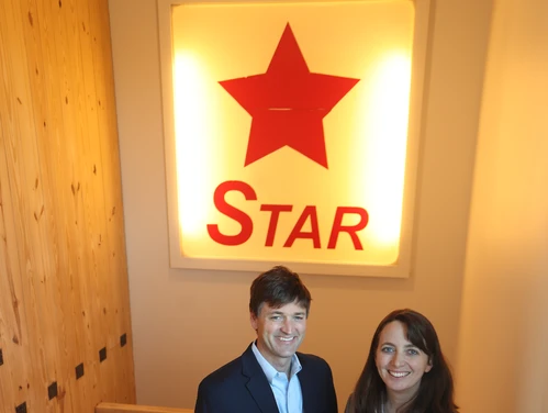 Culter Development team standing in front of STAR sign at StarLofts