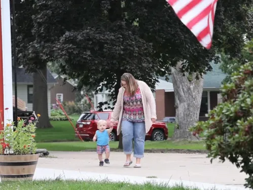 woman and child walking together