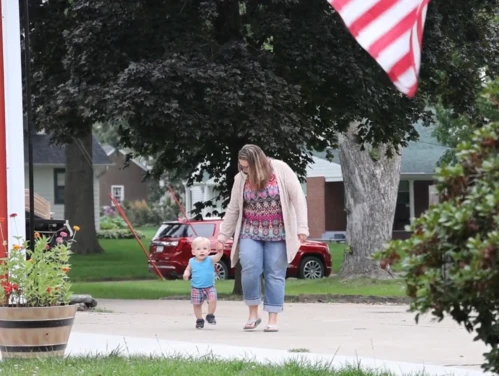 woman and child walking together