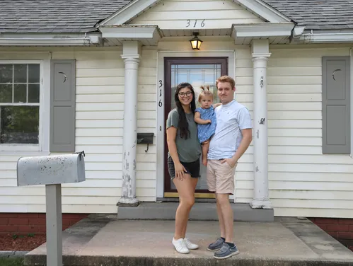 family standing on their front porch