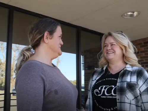 two women talking together