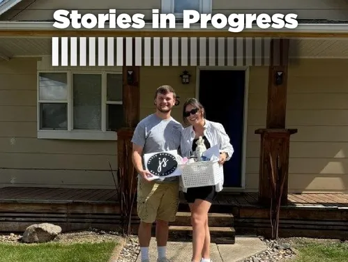 two people standing in front of a home