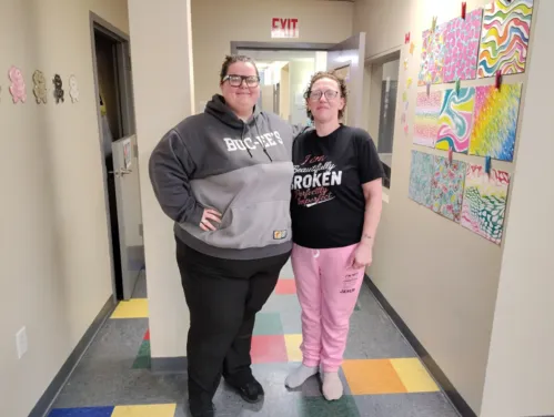 Two women standing side by side.
