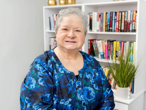 Woman's headshot in floral shirt