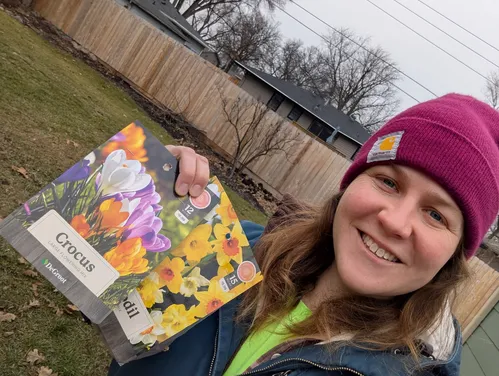 Woman holding flower packets