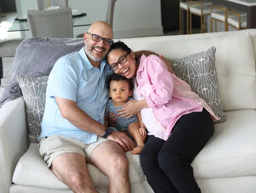 Family of three on couch