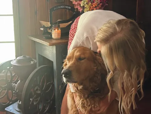 girl with dog inside home