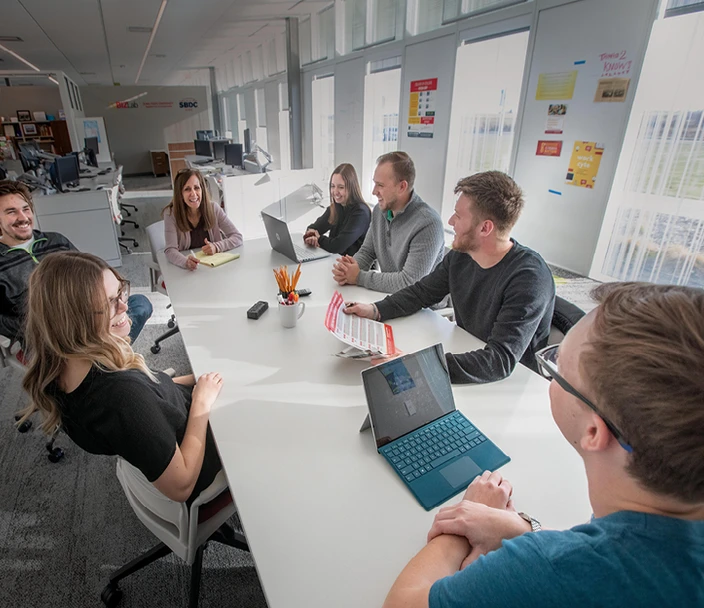 group of people meeting around a table