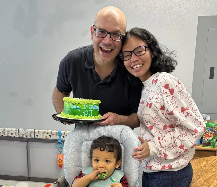 Family with toddler at a  celebration