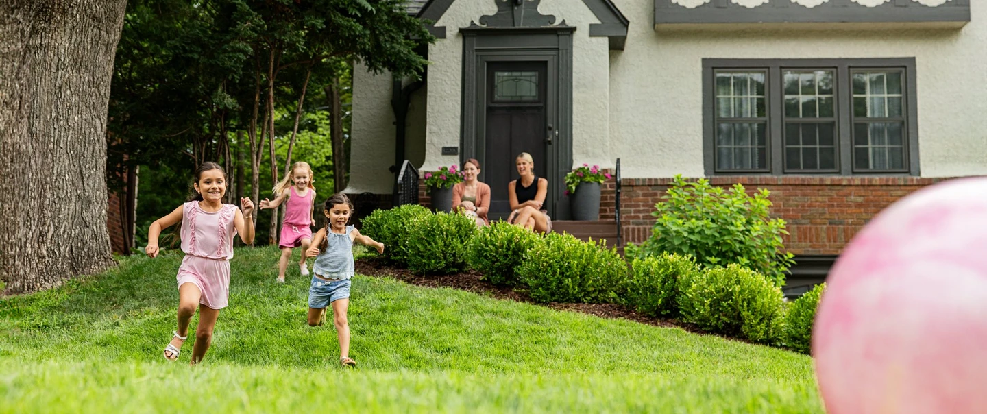 kids playing in a front yard