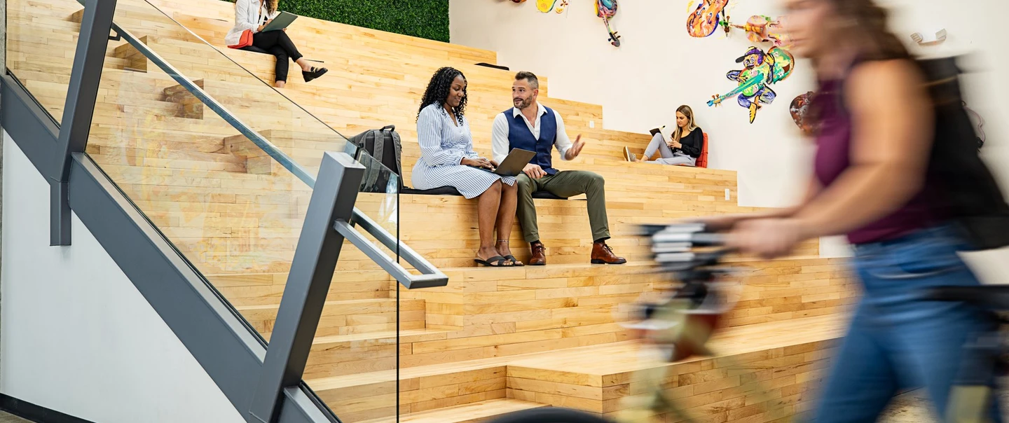 Two people collaborating on work in a coworking space