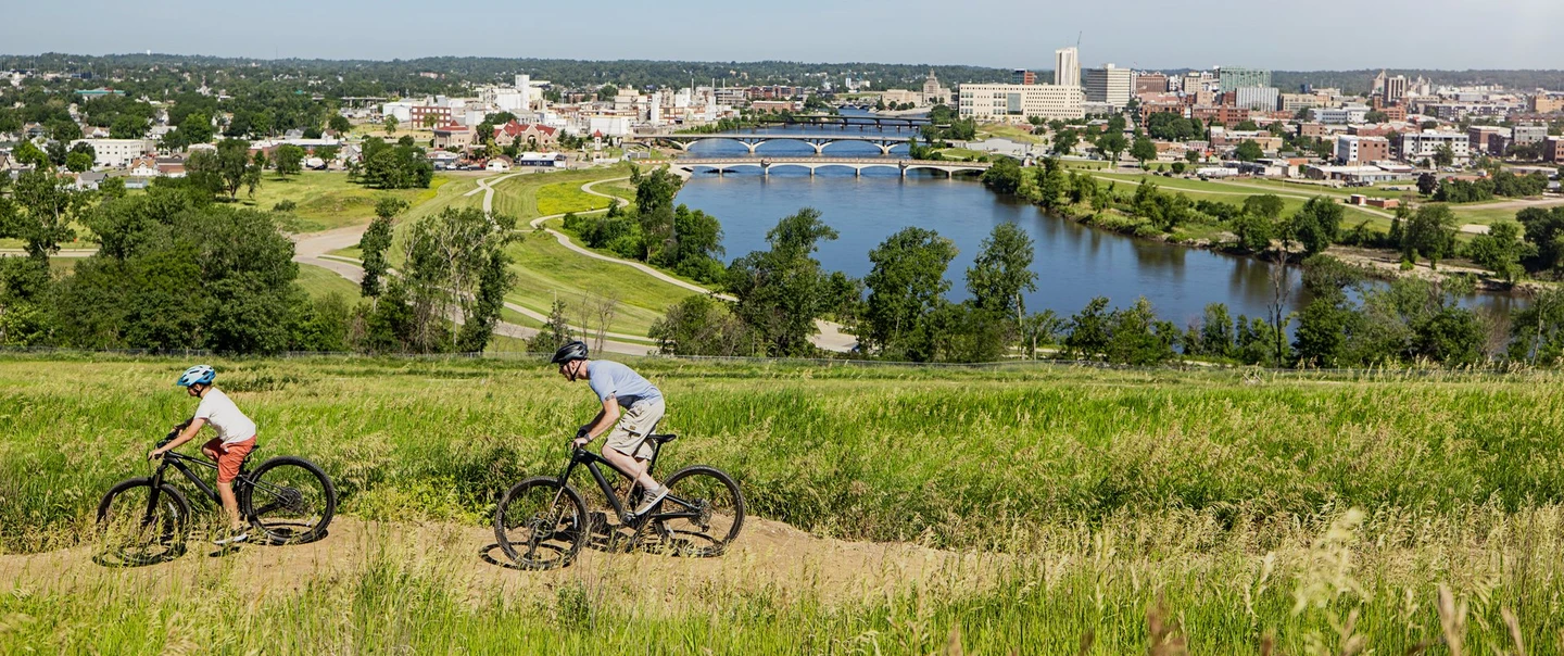 Two bikers on a trail at Mount Trashmore in Cedar Rapids