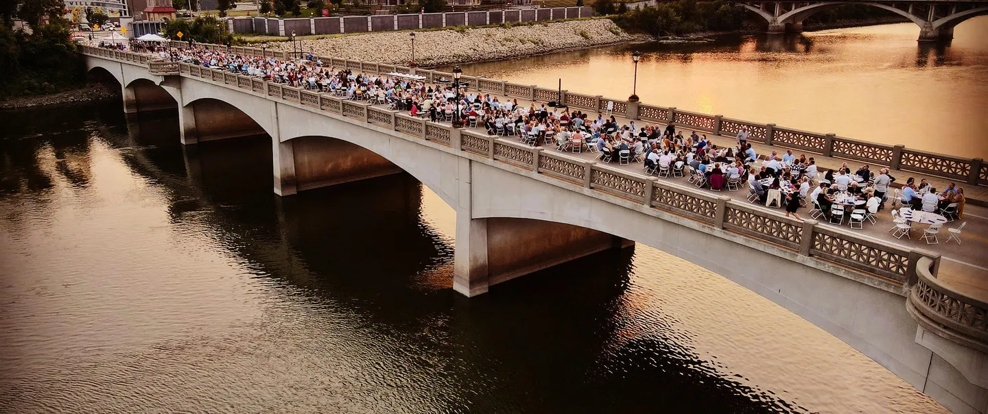 People dining on a bridge