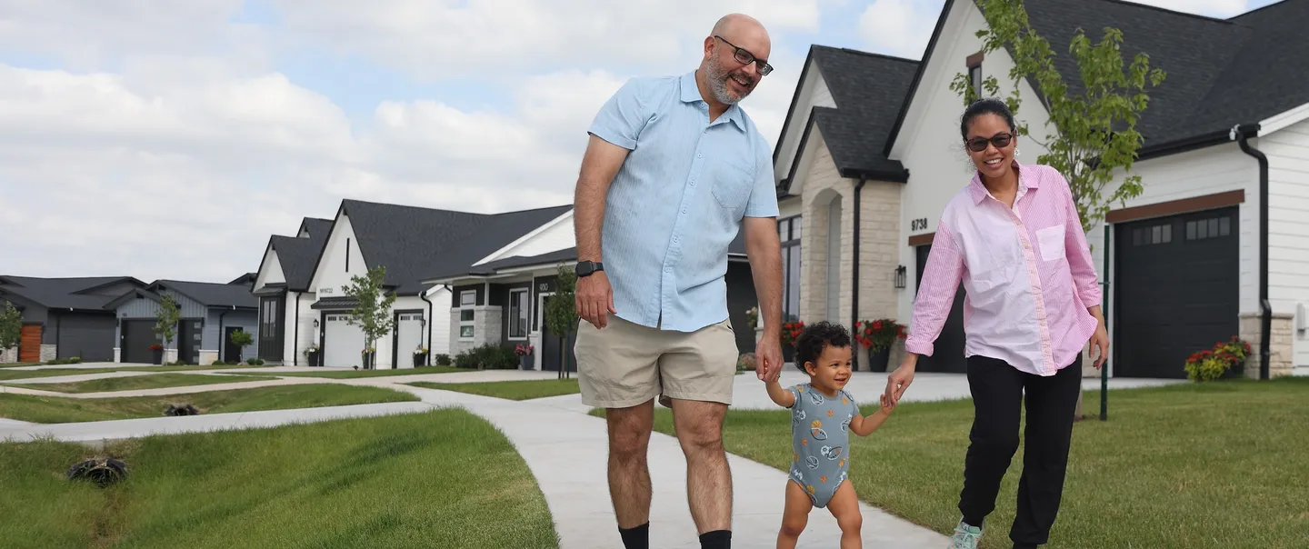 family walking in neighborhood