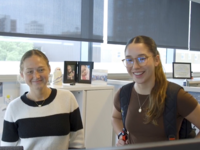 Interns looking at a computer together