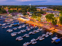 boats docked at lake okoboji by ferris wheel