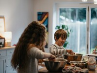 two kids cooking in the kitchen