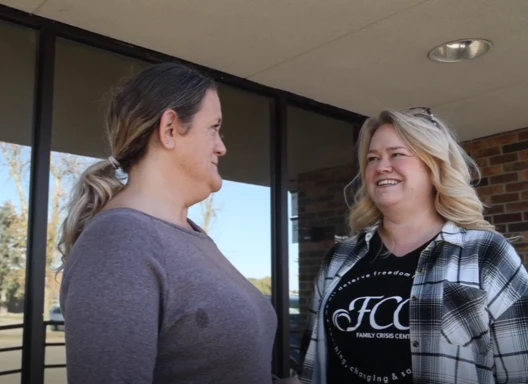 two women talking together