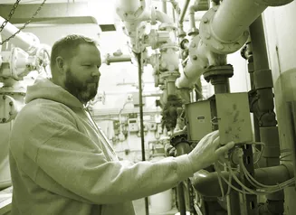 A man working in a city water treatment plant