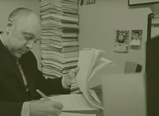 A man signing documents