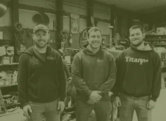 Three brothers standing together, smiling