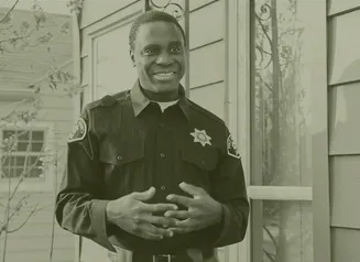 A Public Safety Officer standing and smiling