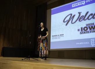 Student competing in the 2024 Iowa State Finals of Poetry Out Loud